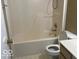 Clean bathroom with a tub and shower combo with neutral-colored tile flooring at 6030 Tybalt Cir, Indianapolis, IN 46254