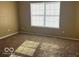 Bright bedroom featuring a large window providing lots of natural light and neutral carpeting at 6030 Tybalt Cir, Indianapolis, IN 46254