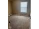 Bright bedroom features new carpet and a large window at 6030 Tybalt Cir, Indianapolis, IN 46254