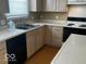 Kitchen with a double sink, black dishwasher and electric range at 6030 Tybalt Cir, Indianapolis, IN 46254