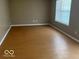 Sun-filled Living Room features vinyl floors at 6030 Tybalt Cir, Indianapolis, IN 46254