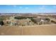 An aerial view showcasing a rural community with scattered homes, open fields, and tree-lined roads at 6416 E Urmeyville Rd, Franklin, IN 46131