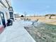 Expansive backyard with concrete patio, seating, grill, and plenty of room for activities at 6416 E Urmeyville Rd, Franklin, IN 46131