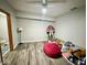 Simple basement includes ceiling fan and wood-look flooring, ready to be customized to your liking at 6416 E Urmeyville Rd, Franklin, IN 46131