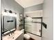 Stylish bathroom featuring a vanity sink, decorative mirror, and modern walk-in shower at 6416 E Urmeyville Rd, Franklin, IN 46131