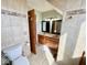 Bathroom features a double sink vanity with a toilet and linen closet for ample storage at 6416 E Urmeyville Rd, Franklin, IN 46131