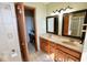Bright bathroom features double vanity with granite countertops and a makeup counter nook for added convenience at 6416 E Urmeyville Rd, Franklin, IN 46131