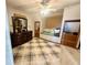Cozy bedroom features a window nook, built-in drawers, and modern ceiling fan at 6416 E Urmeyville Rd, Franklin, IN 46131