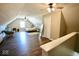 Spacious upper-level bedroom with wood-look flooring, ceiling fans, and natural light at 6416 E Urmeyville Rd, Franklin, IN 46131