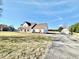 Wide shot of the home, highlighting the expansive yard and outdoor basketball area at 6416 E Urmeyville Rd, Franklin, IN 46131