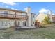 Back of the property with deck, patio space, and small lawn area at 6454 Bay Harbor Ln, Indianapolis, IN 46254