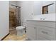 Bathroom with a vanity, toilet, and tiled shower stall with shower curtain at 6454 Bay Harbor Ln, Indianapolis, IN 46254