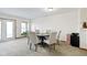 Bright dining room with a round table set, light-colored chairs, and natural light for comfortable gatherings at 6454 Bay Harbor Ln, Indianapolis, IN 46254