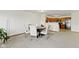 Open-concept dining area with an inviting round table and chairs, seamlessly connects to the kitchen at 6454 Bay Harbor Ln, Indianapolis, IN 46254