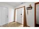 Inviting foyer with white walls, tile flooring, and decorative storm door at 6454 Bay Harbor Ln, Indianapolis, IN 46254