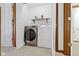 Convenient laundry room with modern appliances, featuring a front-load washer and dryer at 6454 Bay Harbor Ln, Indianapolis, IN 46254