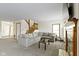 Spacious living room featuring a staircase, comfortable seating, and fireplace, creating a warm and inviting atmosphere at 6454 Bay Harbor Ln, Indianapolis, IN 46254