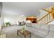 The open layout seamlessly connects the living room and dining area, creating a harmonious flow for easy living at 6454 Bay Harbor Ln, Indianapolis, IN 46254