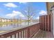 Balcony view with a scenic pond in the distance of neighborhood residences at 6454 Bay Harbor Ln, Indianapolis, IN 46254