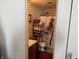 Cozy bathroom with a shower and bathtub combination with a tree-themed shower curtain and shelves at , Indianapolis, IN 46217