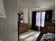 Bright bedroom with carpet, natural light, a dresser, and a bunk bed with a view of outside at , Indianapolis, IN 46217
