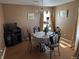 Traditional dining room with decorative chairs, a floral tablecloth, and a classic chandelier at , Indianapolis, IN 46217