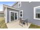A home's patio has seating for outdoor dining and entertainment; enjoy the backyard at 6713 Cardiff Dr, McCordsville, IN 46055