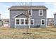 A home's backyard features a patio with seating and a view of the neighborhood at 6713 Cardiff Dr, McCordsville, IN 46055