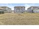 View of the home's rear facade featuring a lawn with adequate space for outdoor activities and relaxation at 6713 Cardiff Dr, McCordsville, IN 46055