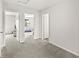 Bright hallway that provides a view into two of the bedrooms in the home at 6713 Cardiff Dr, McCordsville, IN 46055
