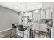 Modern kitchen featuring an island with seating, stainless steel appliances, and white cabinets at 6713 Cardiff Dr, McCordsville, IN 46055