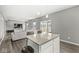 Bright living room featuring an open concept with kitchen and dining area at 6713 Cardiff Dr, McCordsville, IN 46055