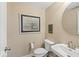 Powder room with decorative artwork, modern toilet, sleek sink, and stylish fixtures at 681 Greenford N Trl, Carmel, IN 46032
