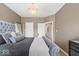 Bedroom with large bed, carpet floors, and chandelier at 681 Greenford N Trl, Carmel, IN 46032
