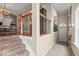 Entryway with wood and iron railing, neutral walls, and hardwood stairs leading up to the main level at 681 Greenford N Trl, Carmel, IN 46032