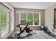 Bright exercise room features modern equipment, natural light, and neutral colors at 681 Greenford N Trl, Carmel, IN 46032