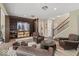 Inviting living room featuring a stylish wine cellar, hardwood floors, and comfortable leather seating at 681 Greenford N Trl, Carmel, IN 46032