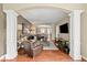 Spacious living room with an open-concept layout, showcasing a comfortable seating area and seamless flow to the dining room at 681 Greenford N Trl, Carmel, IN 46032