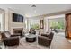 Cozy living room with fireplace, tile floors, and natural light at 681 Greenford N Trl, Carmel, IN 46032