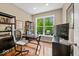 Bright home office with a large window, providing natural light and a view of the surrounding landscape at 681 Greenford N Trl, Carmel, IN 46032