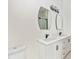 Elegant bathroom featuring a double vanity with modern fixtures and stylish mirrors at 711 N Fenton Ave, Indianapolis, IN 46219