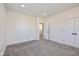 Bright bedroom featuring two closets with black door knobs and carpeted floors at 711 N Fenton Ave, Indianapolis, IN 46219