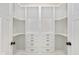 Custom walk-in closet with built-in shelving and drawers for optimal organization at 711 N Fenton Ave, Indianapolis, IN 46219