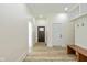 Bright entryway with a wooden bench and hooks, offering a welcoming and organized space as you enter at 711 N Fenton Ave, Indianapolis, IN 46219