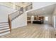 Open concept floor plan with living room staircase leading to the kitchen with a large island at 711 N Fenton Ave, Indianapolis, IN 46219