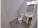 Neutral bathroom featuring a pedestal sink, patterned tile flooring and neutral colored walls at 726 E Mccarty St, Indianapolis, IN 46203