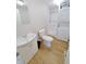 Functional bathroom with a shower, toilet, vanity, and stackable washer/dryer at 726 E Mccarty St, Indianapolis, IN 46203