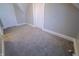Cozy room with neutral carpet, two closets and neutral colored walls at 726 E Mccarty St, Indianapolis, IN 46203