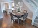 Lovely dining area with hardwood floors, a round table, and easy access to both the kitchen and living room at 726 E Mccarty St, Indianapolis, IN 46203