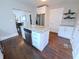 Spacious kitchen showcasing hardwood floors, white cabinets, granite countertops, and stainless steel appliances at 726 E Mccarty St, Indianapolis, IN 46203